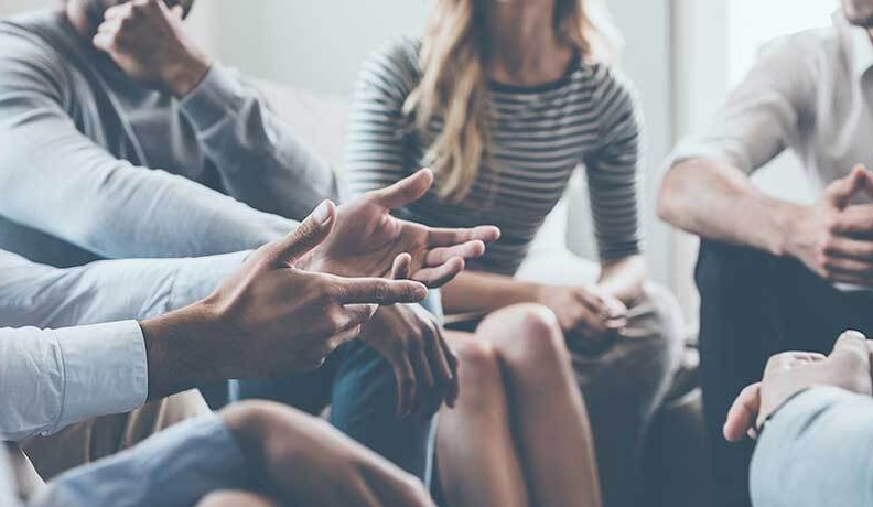 NBG Partner Survey Shows Surge in Branch Reopenings A circle of people talking at reopened merchant branch as NBG survey shows post-pandemic recovery